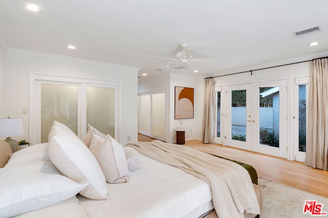 bedroom featuring crown molding, light wood-type flooring, french doors, access to outside, and ceiling fan