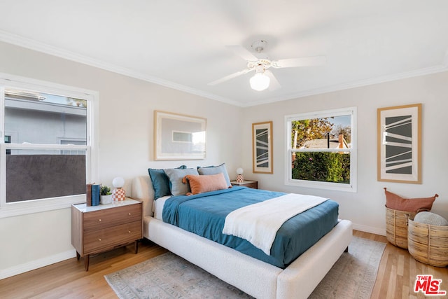 bedroom with ceiling fan, light hardwood / wood-style floors, and ornamental molding