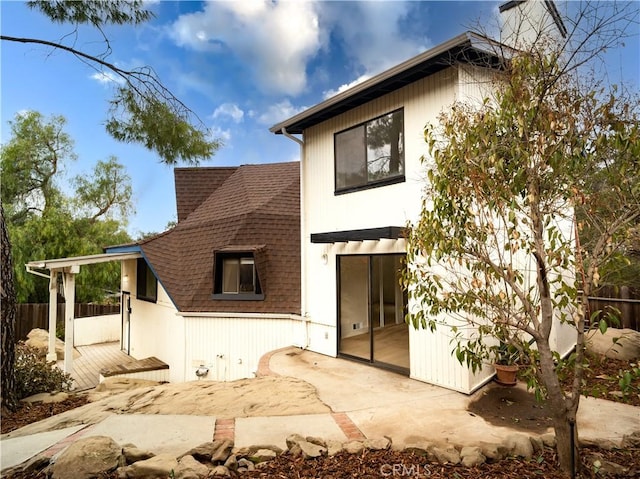 rear view of house featuring a patio