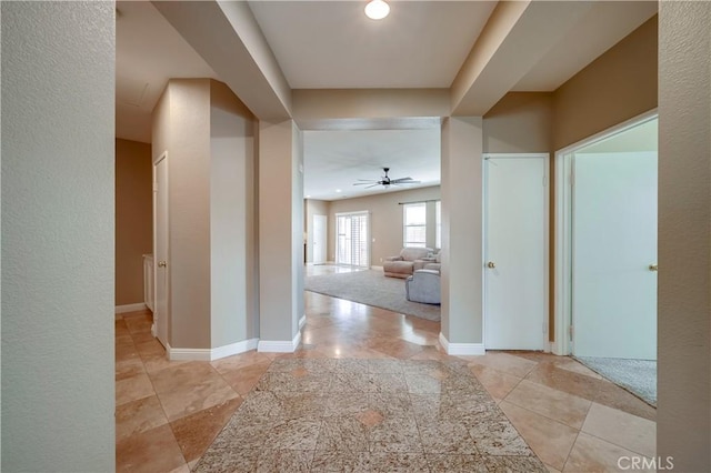 hallway with light tile patterned floors