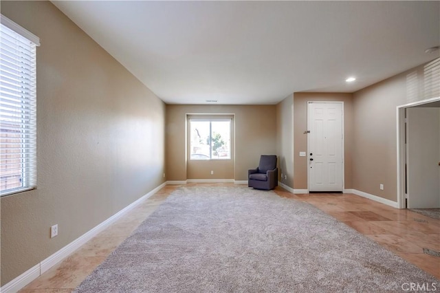 unfurnished room featuring light tile patterned floors