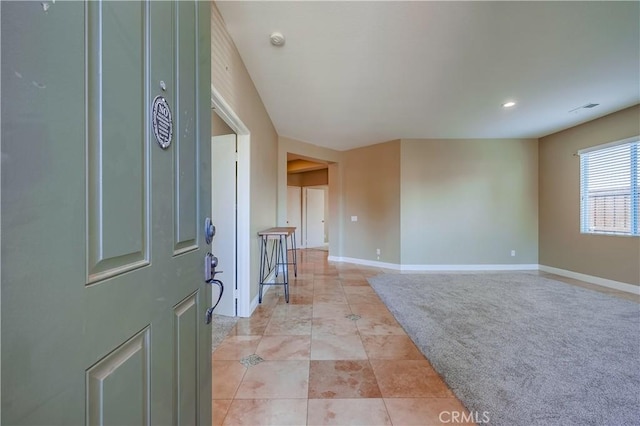 entrance foyer featuring light tile patterned floors