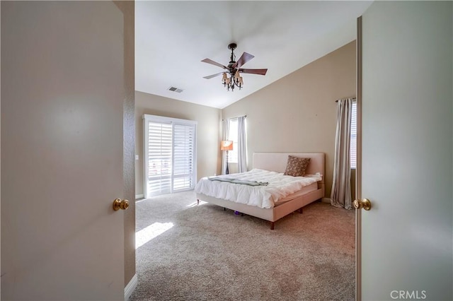 bedroom featuring carpet flooring, vaulted ceiling, and ceiling fan