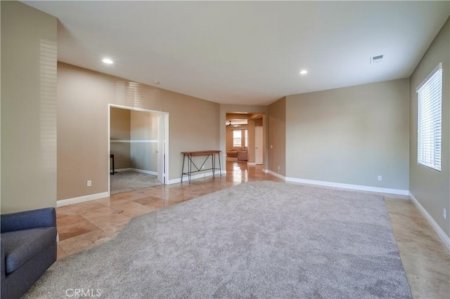 unfurnished room featuring light tile patterned floors