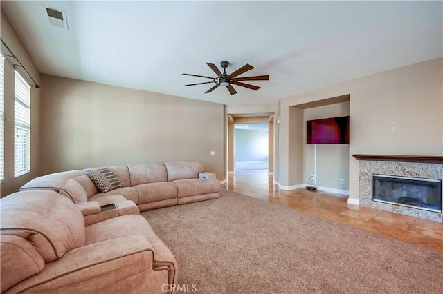 carpeted living room featuring a fireplace