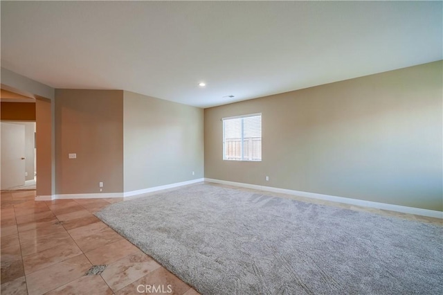 empty room featuring light tile patterned floors