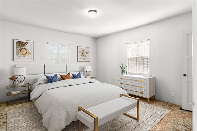 carpeted bedroom featuring multiple windows