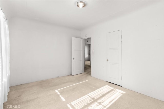 unfurnished bedroom featuring light colored carpet