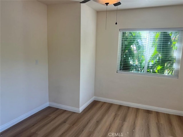 spare room with wood-type flooring