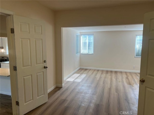 spare room with light wood-type flooring