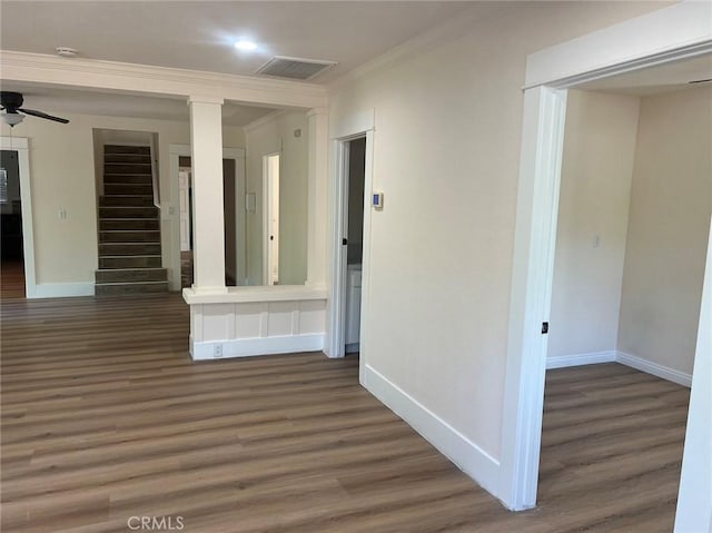 hallway with ornamental molding and dark hardwood / wood-style floors