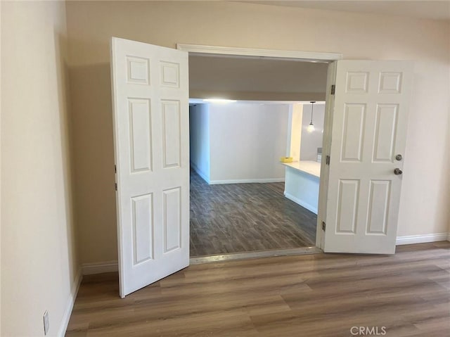 hallway featuring hardwood / wood-style floors