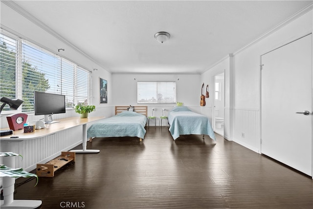 bedroom featuring crown molding and dark wood-type flooring