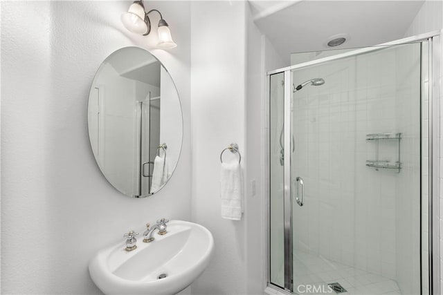 bathroom featuring sink and walk in shower