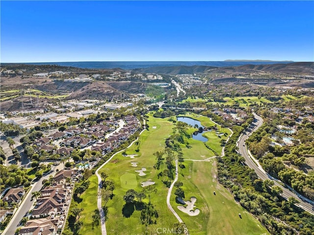 drone / aerial view with a water and mountain view