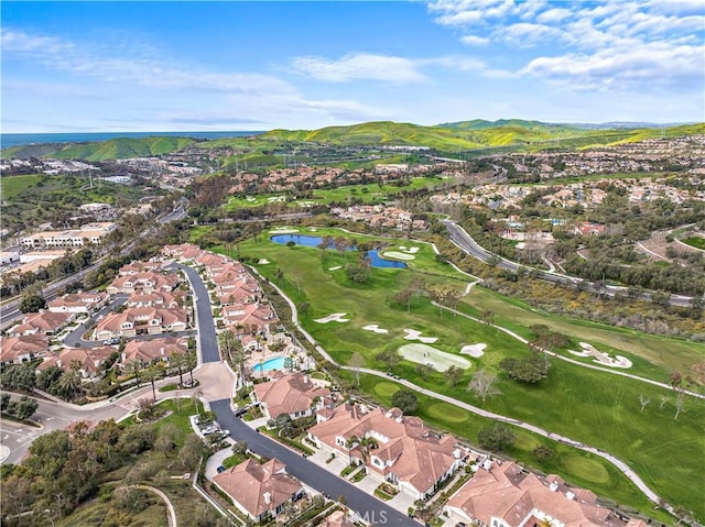 birds eye view of property with a water and mountain view