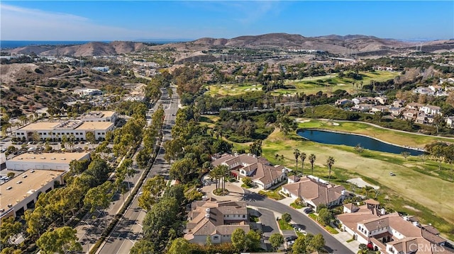 drone / aerial view with a water and mountain view