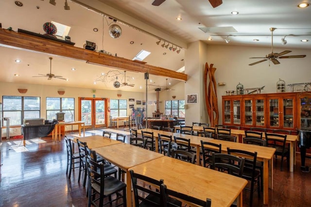 dining room with dark hardwood / wood-style floors, beamed ceiling, high vaulted ceiling, and ceiling fan