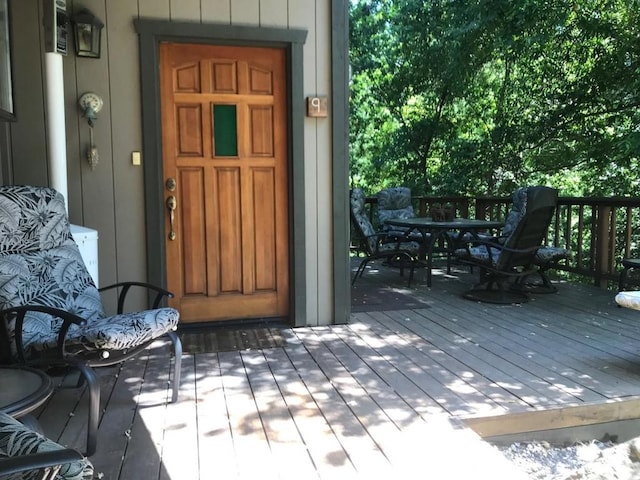 doorway to property with a wooden deck