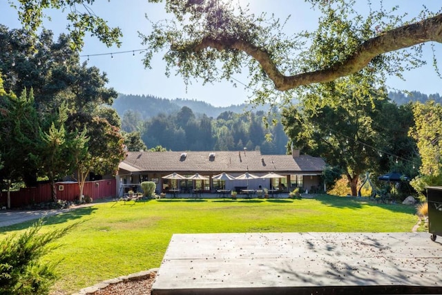 back of property featuring a yard and a patio