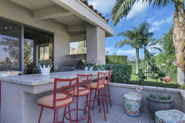 view of patio / terrace featuring a bar