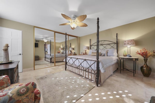 bedroom with ceiling fan and a closet