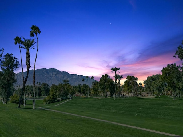 view of community featuring a mountain view and a lawn