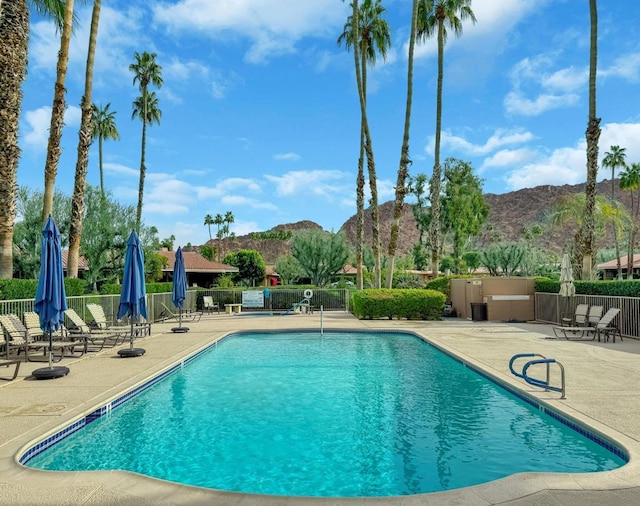 view of pool featuring a mountain view and a patio