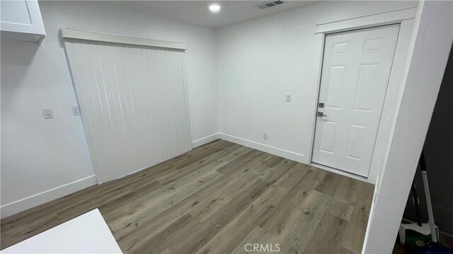 interior space with hardwood / wood-style flooring