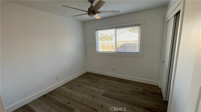 interior space featuring ceiling fan and dark hardwood / wood-style flooring