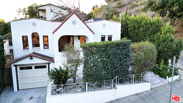 view of front of property with a garage