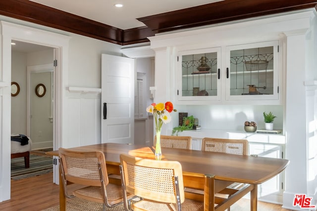 interior space with white cabinets and light hardwood / wood-style floors