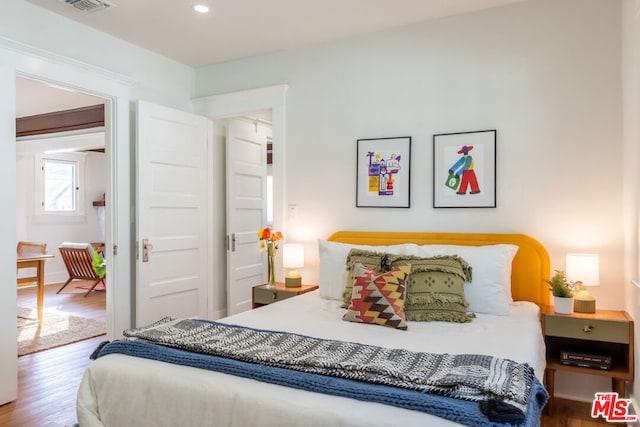 bedroom featuring wood-type flooring