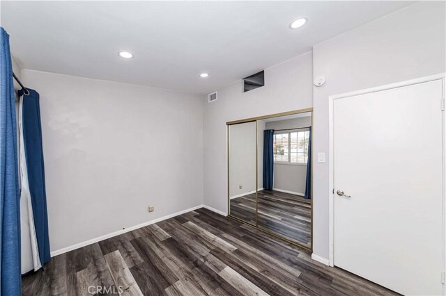 unfurnished room featuring dark hardwood / wood-style flooring