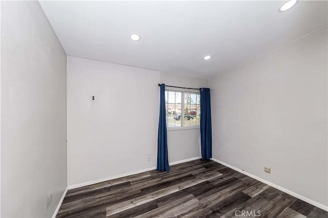 empty room with dark hardwood / wood-style floors