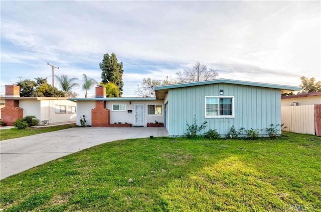 ranch-style house with a front lawn