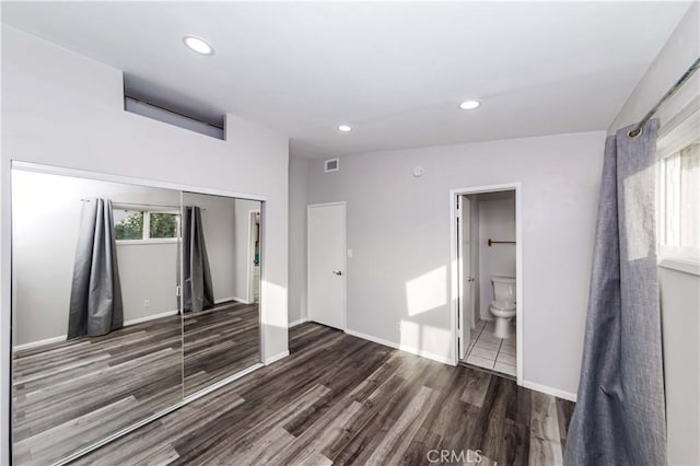 empty room featuring dark wood-type flooring