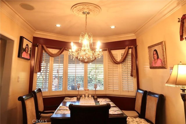 dining space featuring a chandelier and ornamental molding