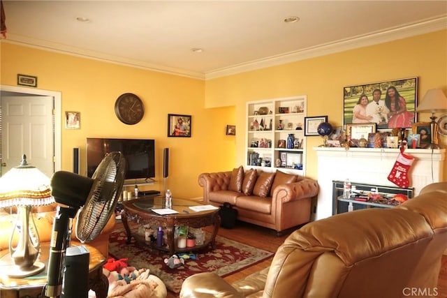 living room featuring built in features, hardwood / wood-style flooring, and ornamental molding