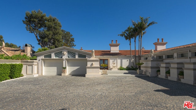 view of front of property featuring a garage