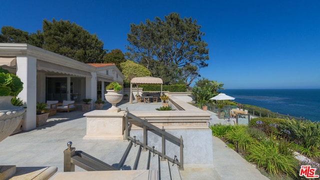 view of patio featuring a water view