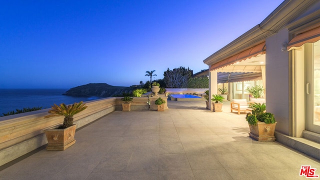 view of patio / terrace with a water view