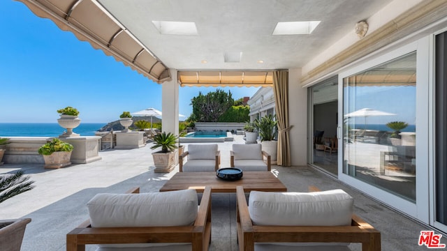 view of patio / terrace featuring a water view and an outdoor hangout area