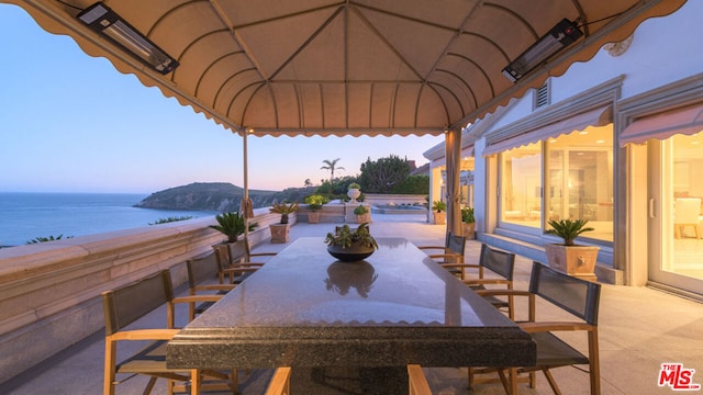 view of patio / terrace featuring a water view