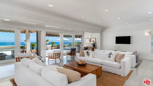 living room with crown molding and a water view