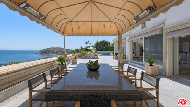 view of patio featuring a water view