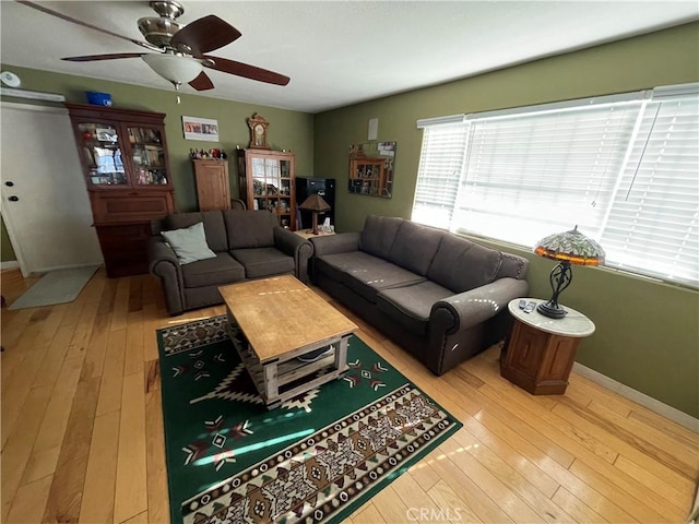 living room with hardwood / wood-style floors and ceiling fan