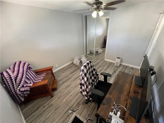 interior space featuring hardwood / wood-style flooring and ceiling fan