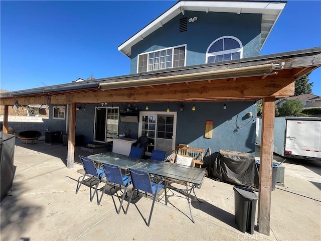 rear view of property with a patio