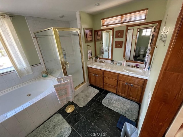 full bathroom featuring independent shower and bath, toilet, tile patterned floors, and vanity